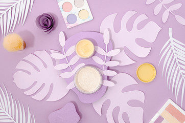 Feminine cosmetics on purple background