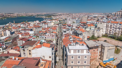 Naklejka na ściany i meble The view from Galata Tower to Golden Horn and city skyline with red roofs timelapse, Istanbul, Turkey