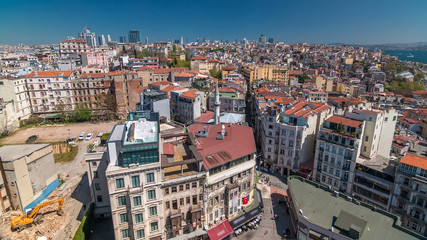 Fototapeta na wymiar The view from Galata Tower to city skyline with red roofs and streets timelapse Bosphorus, Istanbul, Turkey