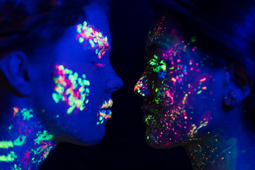 Close-up view of colorful fluorescent make-up