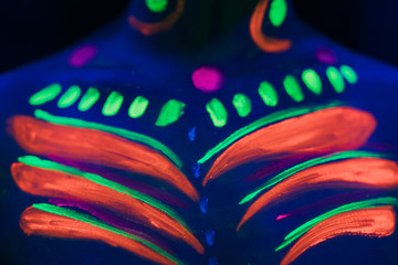 Close-up view with colorful fluorescent make-up