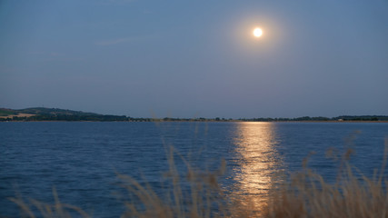 Moon and moonlight timelapse with mirror on lake