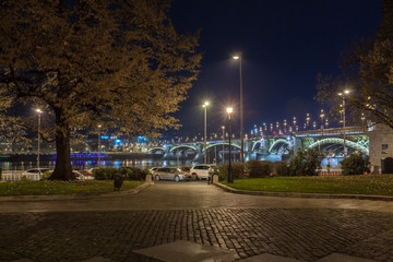 View of Margaret Bridge illuminated at night in Budapest, Hungary