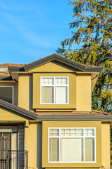 The top of the house or apartment building with nice window.