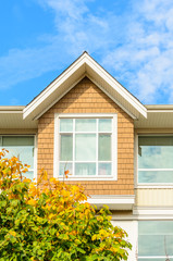The roof of the house with nice window.