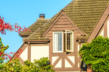 The roof of the house with nice window.