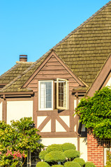 The roof of the house with nice window.
