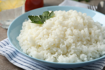 Composition with delicious rice on grey background, close up