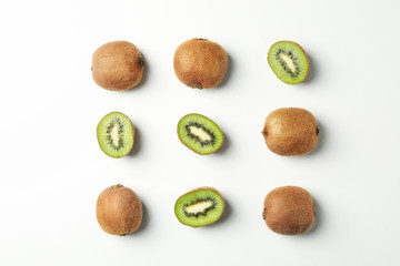 Flat lay with kiwi on white background, top view