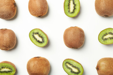 Flat lay with kiwi on white background, top view