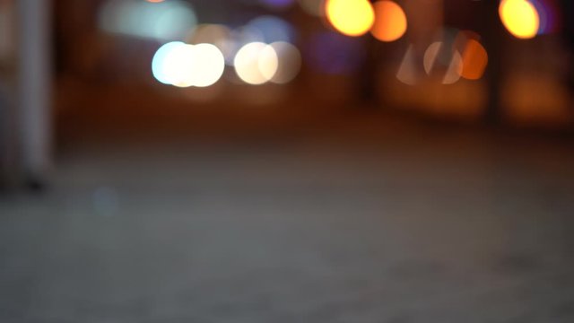 Roller shutters at closed shop door on a city street in the evening, urban streets at night.