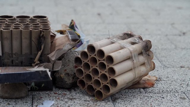 Pile of used fireworks on the street after Birthday, New Year, Christmas celebrations.