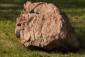 Huge stone on the ground.