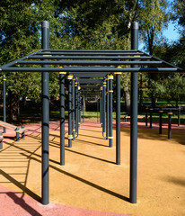 Outdoor sports ground. Horizontal bars. Children's game complex on the outdoor sports ground.