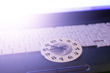 The clock face on the laptop keyboard
