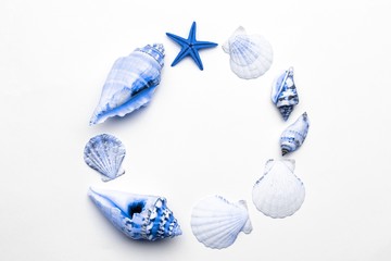 Tropical background. Aquamarine light blue Sea shell with starfish and shells in shape frame. Summer background. Top view with copy space.