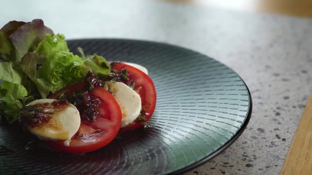 Close up of caprese on plate.