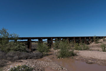 Mimbres river railroad trestle and blue sky.