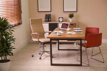 Director's office with large wooden table. Interior design