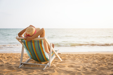 Woman on beach in summer - 324904411