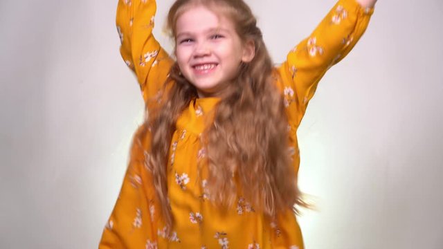 Leaps and rejoices in the girl in the orange dress
