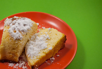 homemade cheesecake serving on red plate