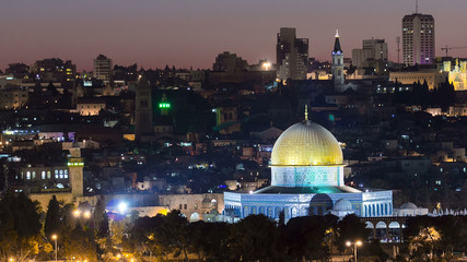 Fototapeta na wymiar Evening in Old City, Temple Mount with Dome of the Rock timelapse view from the Mt of Olives in Jerusalem