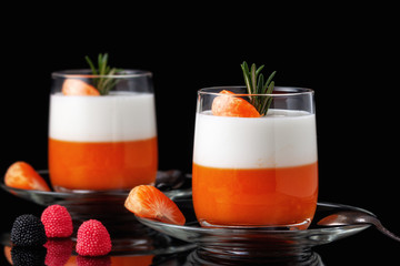 Fototapeta na wymiar Panna Cotta with tangerines, jelly and rosemary, Italian dessert, home cooking. Copy space