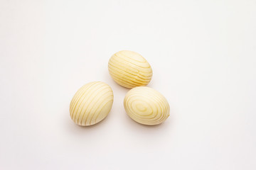 Wooden eggs isolated on white background. Easter zero waste concept