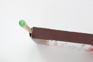 Hunting waterproof matches in a paper box isolated on white background