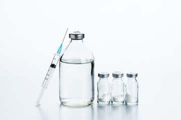 Vaccination kit. Antibiotics in glass bottles, powder and saline to dilute the medicine.