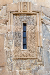 Naklejka premium Narrow window of an old medieval Church