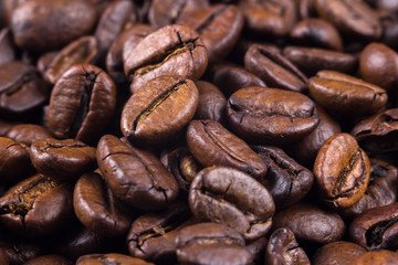 Macrophotography of black coffee beans. Close up