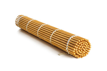 Rolled-up bamboo sushi Mat isolated on white background
