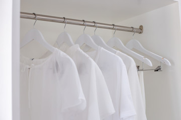White shirt set in a white closet