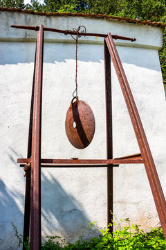 Old rusty metal semantron outside the Holy Trinity Church at the village of Malo Malovo, Dragoman Municipality, Sofia Province, Western Bulgaria