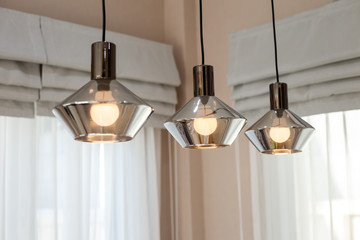 A warm color lamp hanging on the ceiling