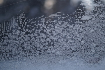 frost painted snowflakes on glass