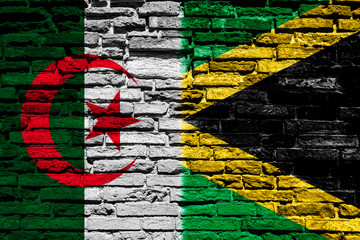 Flag of Algeria and Jamaica on the brick wall