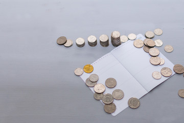 Coin money stack and book bank with space for text background. Saving and financial security...