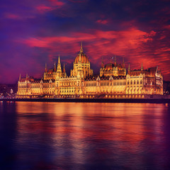 Fototapeta na wymiar Incredible Evening View of Budapest parliament at sunset, Hungary. Wonderful Cityscape with Colorful sky. Popular travel destination and best place for photographers. Instagram Style. Creative image