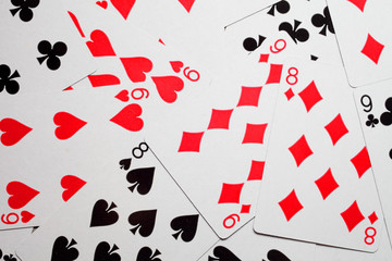 playing cards scattered on the table texture background