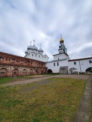Fototapeta na wymiar October 17, 2019 Russia, the city of Vologda. Depicted are two intersecting walls of brick and white, the St. Sophia Cathedral of the Wisdom of God, with domes in the background