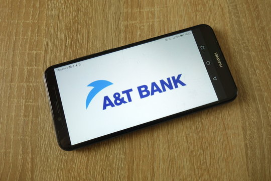 KONSKIE, POLAND - March 16, 2019: A&T Bank logo displayed on smartphone