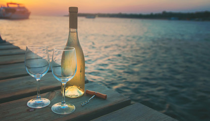 Drink wine by the sea. Selective focus.