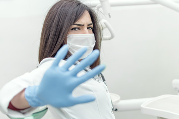 Young female doctor is insulted by patient's bribing and she refusing money