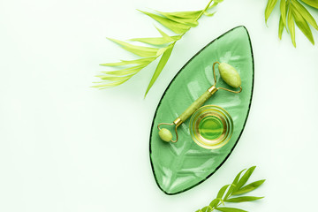 Spa background with jade roller and massage natural oil © fortyforks
