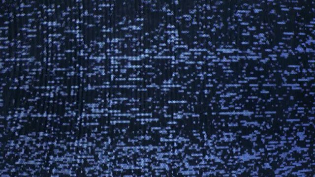 Video display with no signal being transmitted. Glitches, broadcast noise, abstract glitch.