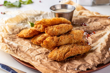 Chicken Nuggets Served on a Plate with White Sauce