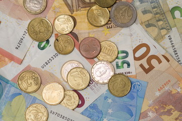close up of euro money banknotes and coins